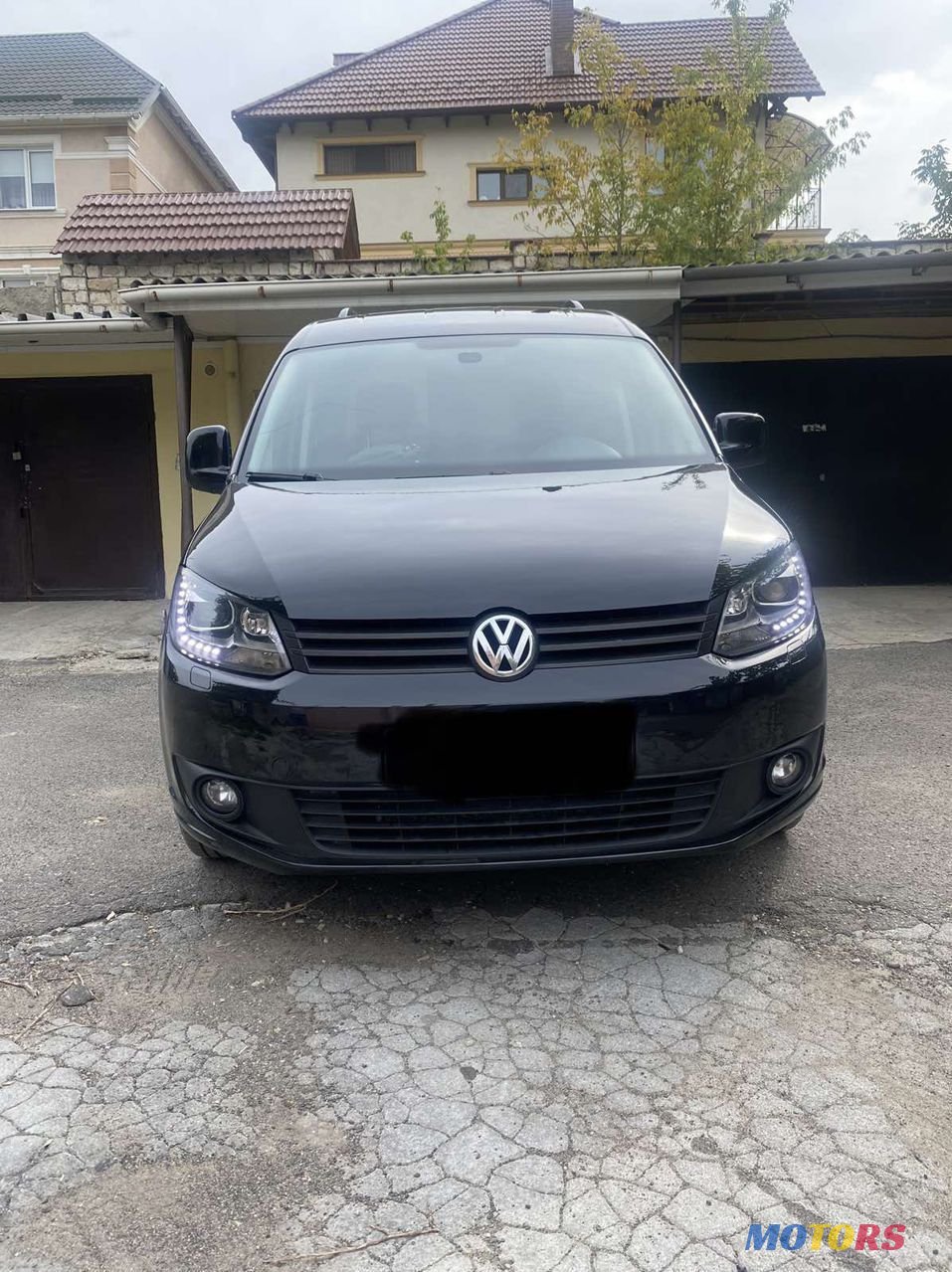 2013' Volkswagen Caddy photo #1