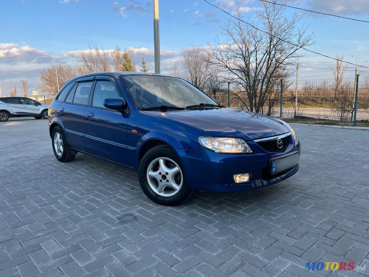 2001' Mazda 323 photo #1