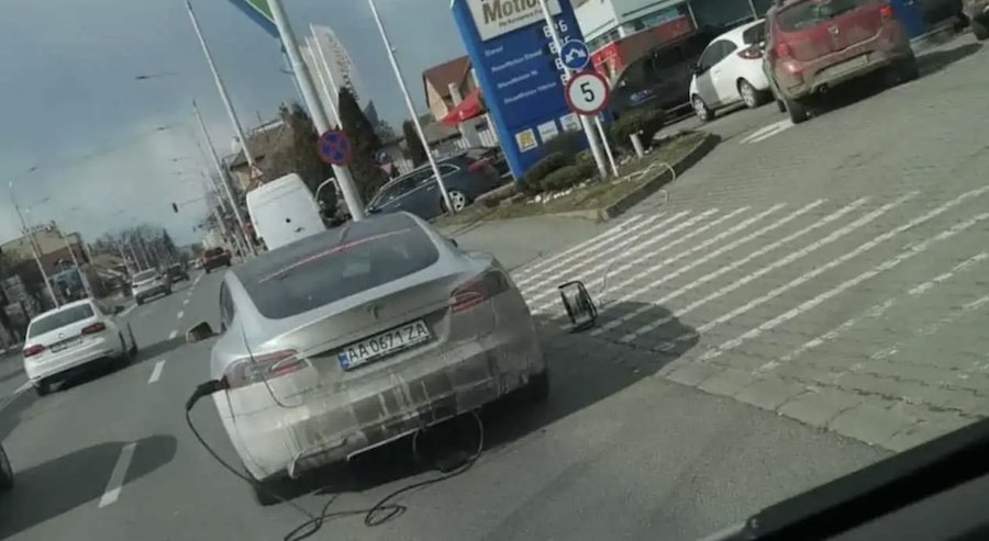 Ukrainian Tesla Driver Stranded In Romania Charges At Gas Station