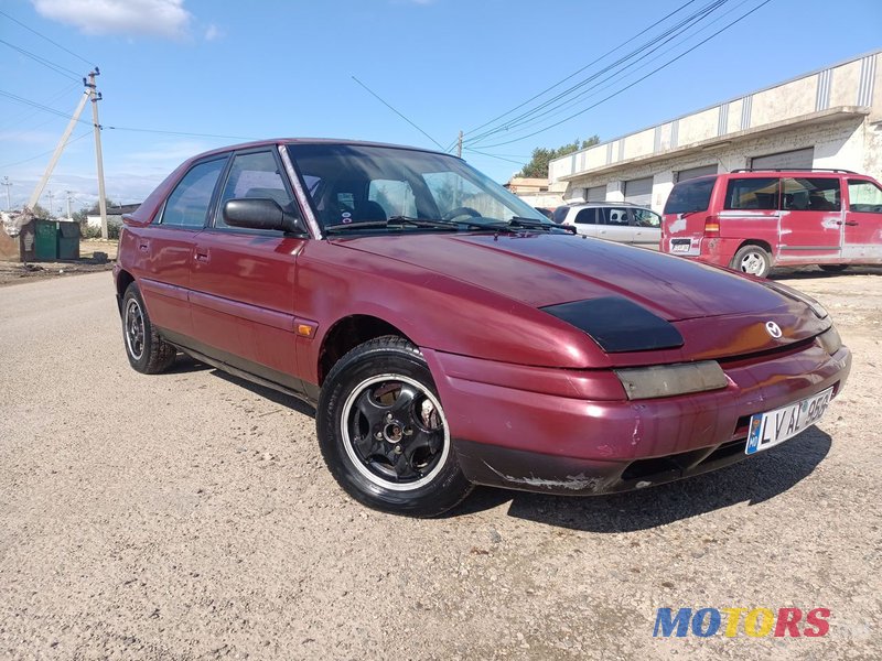 1995' Mazda 323 photo #1