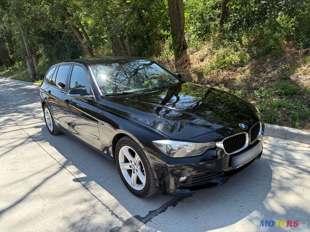 2013' BMW 3 Series Touring photo #1