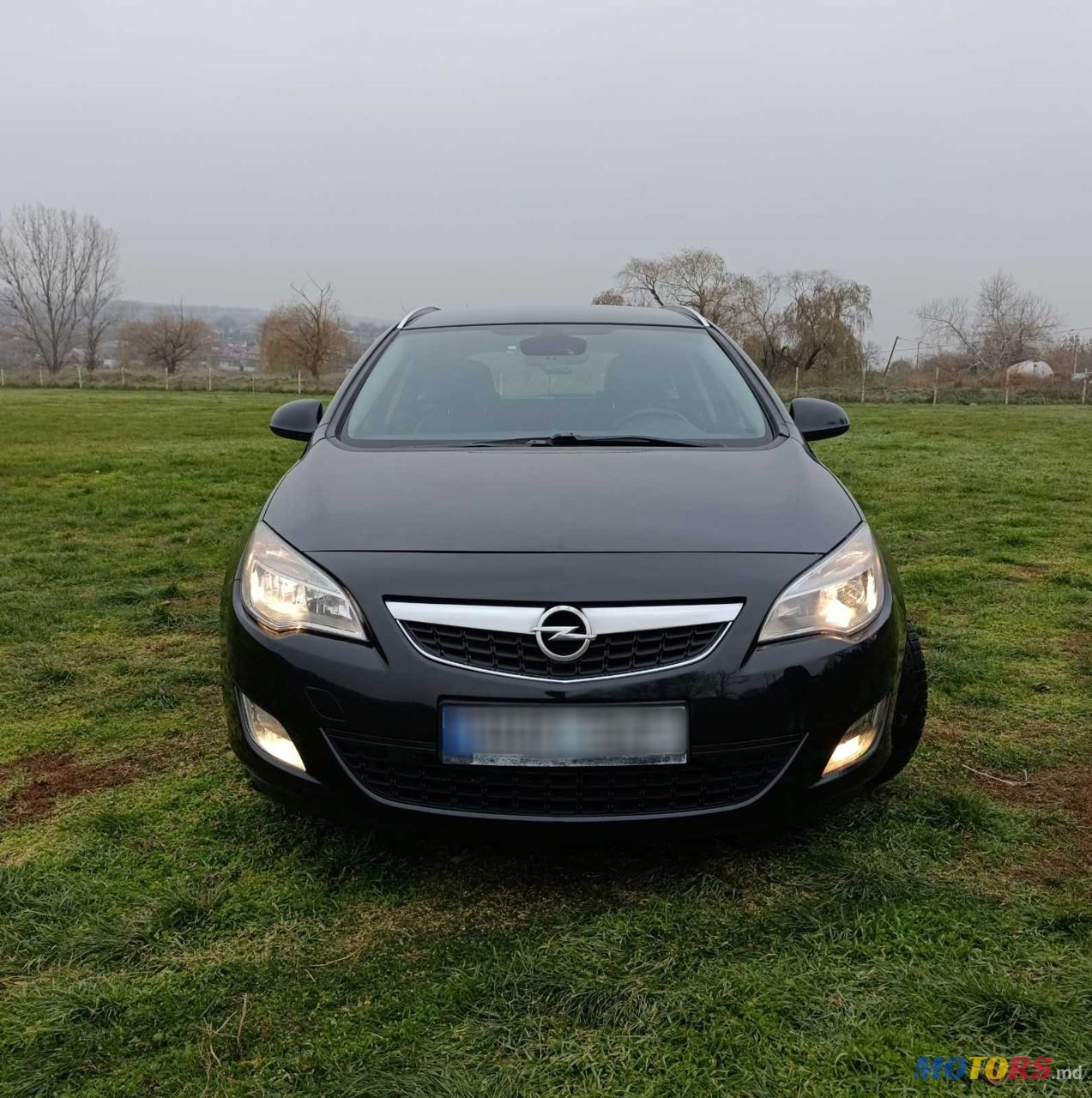 2012' Opel Astra photo #1