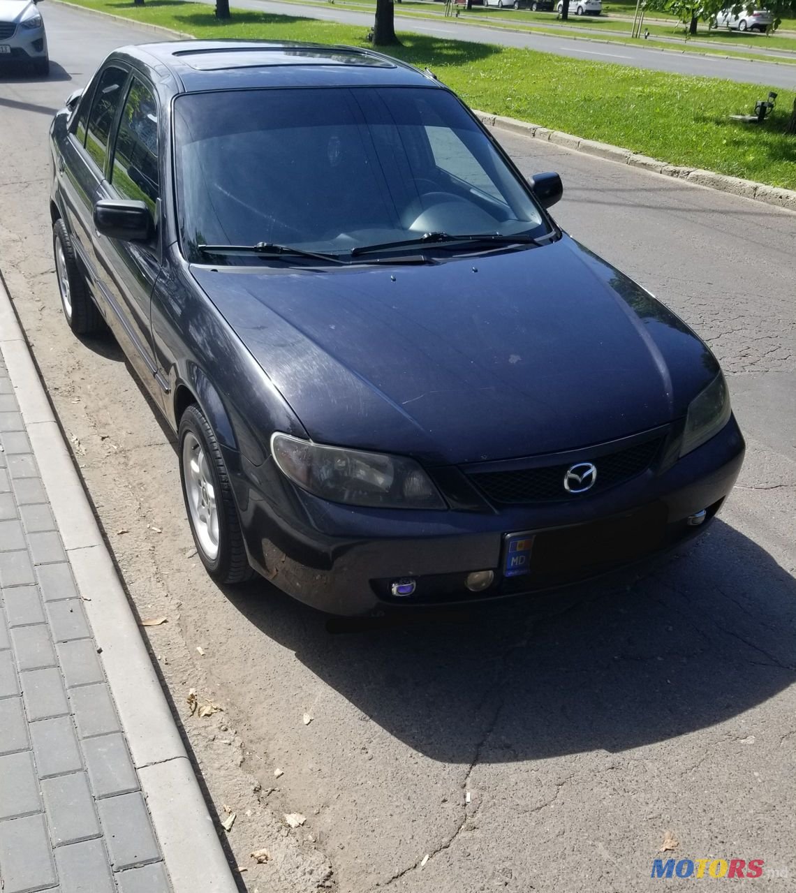 2002' Mazda 323 photo #3