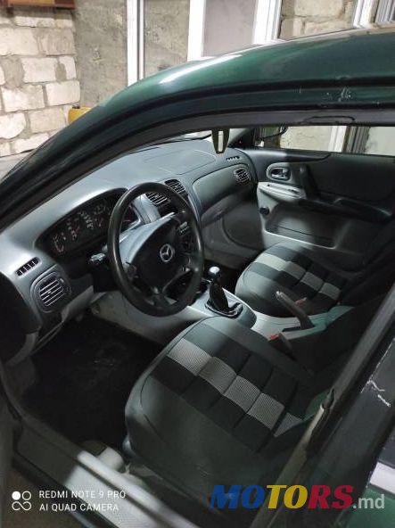 2001' Mazda 323 photo #1