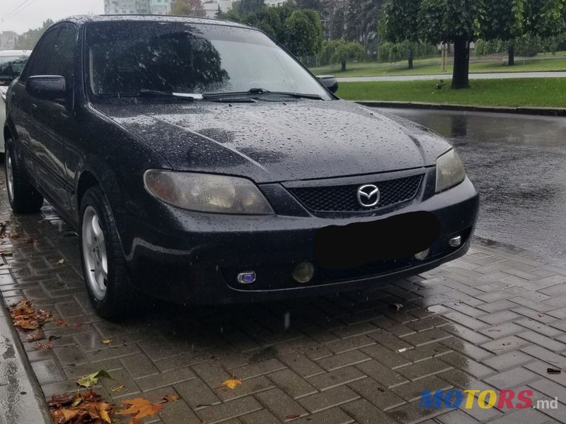 2002' Mazda 323 photo #6