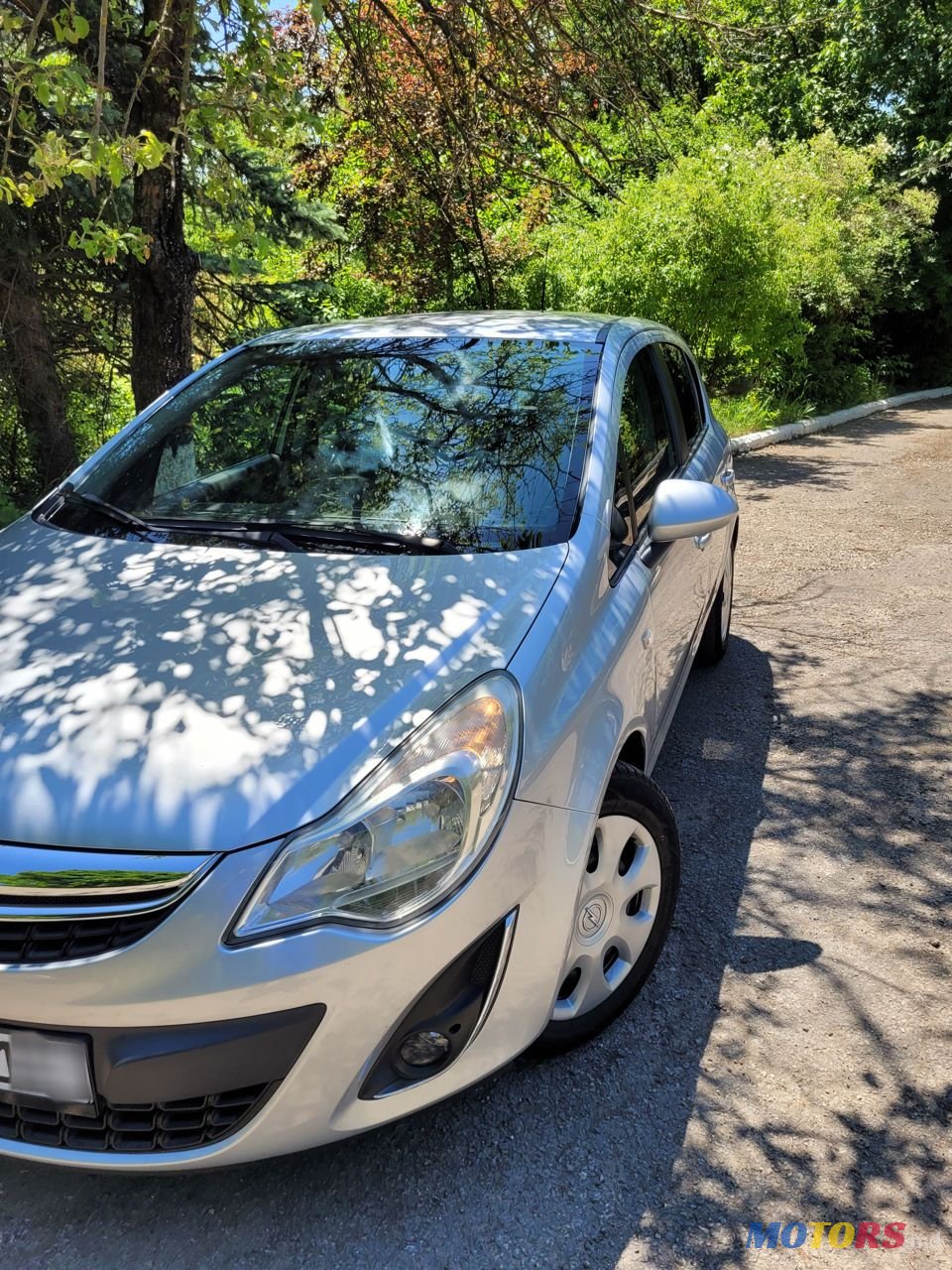 2012' Opel Corsa photo #1