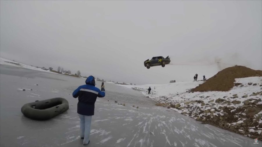 Crazy Russian Jumps Burning Car Into Icy Lake Because Vodka