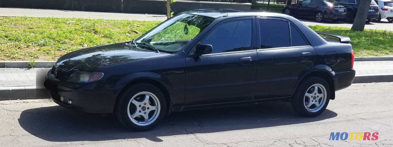 2002' Mazda 323 photo #1