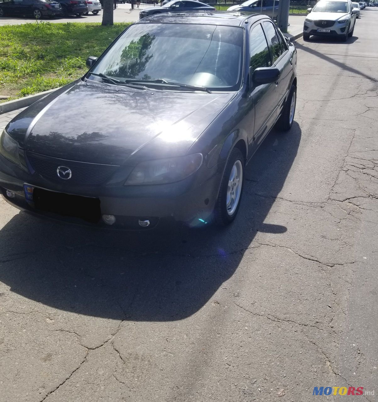 2002' Mazda 323 photo #4