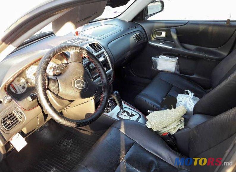 2003' Mazda 323 photo #1