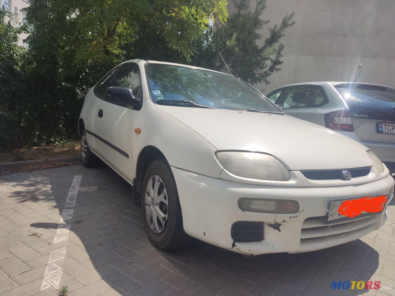 1995' Mazda 323 photo #1